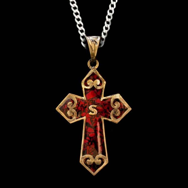 "Our first crushed Turquoise Cross Pendant! The Jude is built on a German Silver base and detailed with our signature crushed stones. Framed by a uniquely designed straight edge and scroll elements. Customize with yoru intial and your favorite color 